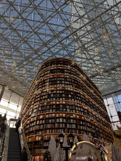 The towering, light-filled bookshelves of Seoul's Starfield Library.